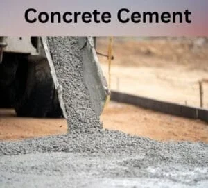 Concrete being poured from a truck onto a construction site. The mixture is gray and wet, spreading onto the ground. The scene conveys industry and progress.